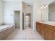 Spacious bathroom with double vanity, soaking tub, and tile flooring at 14044 Chicora Crossing Blvd, Orlando, FL 32828