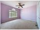 Spacious bedroom features carpeted floors, ceiling fan and a large window at 14044 Chicora Crossing Blvd, Orlando, FL 32828