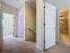 Upstairs hallway leads to bedrooms and bathrooms, offering easy access to private living spaces at 14044 Chicora Crossing Blvd, Orlando, FL 32828