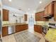Open-concept kitchen featuring stainless steel appliances, granite countertops, and ample cabinet space at 14044 Chicora Crossing Blvd, Orlando, FL 32828