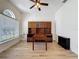 Well-lit home office featuring hardwood floors, window and wooden built-in cabinets at 14044 Chicora Crossing Blvd, Orlando, FL 32828
