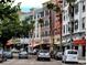 Street view showcasing colorful buildings and palm trees, creating a lively commercial atmosphere at 14044 Chicora Crossing Blvd, Orlando, FL 32828