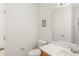 Clean powder room with tile flooring, modern sink, and a large mirror at 14213 Turning Leaf Dr, Orlando, FL 32828
