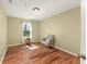 Bedroom with chair near window and hardwood floor at 14213 Turning Leaf Dr, Orlando, FL 32828