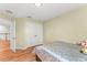 Comfortable bedroom features wood-look floors and closet at 14213 Turning Leaf Dr, Orlando, FL 32828
