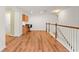 Open bonus room with hardwood floors, built-in desk and lots of natural light from the windows at 14213 Turning Leaf Dr, Orlando, FL 32828