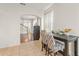 Cozy dining room with neutral tile flooring leading to the kitchen and other living areas at 14213 Turning Leaf Dr, Orlando, FL 32828