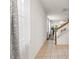 Hallway with tile flooring and a staircase leading to the upper level at 14213 Turning Leaf Dr, Orlando, FL 32828