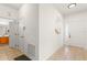 Entryway with tile flooring and neutral paint, leading to various rooms at 14213 Turning Leaf Dr, Orlando, FL 32828