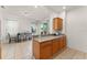 Bright kitchen with an open design, granite countertops, and a breakfast bar overlooking the dining area at 14213 Turning Leaf Dr, Orlando, FL 32828