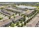 Aerial view of townhomes near a lake and amenity center at 15477 Blackbead St, Winter Garden, FL 34787