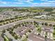 Aerial shot of a Primary-planned townhome community with manicured landscaping at 15477 Blackbead St, Winter Garden, FL 34787
