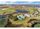 Stunning aerial view of community featuring the pool, waterways, and lush landscaping at 15477 Blackbead St, Winter Garden, FL 34787