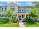 Charming townhouse featuring well-maintained landscaping and a welcoming front porch at 15477 Blackbead St, Winter Garden, FL 34787
