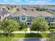 Charming townhome featuring a well-manicured front lawn and welcoming entrance at 15477 Blackbead St, Winter Garden, FL 34787