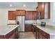 Well-equipped kitchen boasting stainless steel appliances and granite countertops at 15477 Blackbead St, Winter Garden, FL 34787