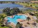 Community pool featuring a resort-style layout, and ample lounge chairs, perfect for relaxation and recreation at 15477 Blackbead St, Winter Garden, FL 34787