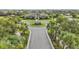 Stunning aerial view of a home's circular driveway, lush landscaping, and well-maintained community at 15779 Tangerine Dream Ct, Winter Garden, FL 34787