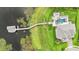 Top-down aerial shot of the home, yard, dock, and boat house on the lake at 15779 Tangerine Dream Ct, Winter Garden, FL 34787
