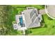 Aerial view of a stunning home featuring a luxurious pool, spa, and beautifully landscaped backyard oasis at 15779 Tangerine Dream Ct, Winter Garden, FL 34787