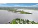 Picturesque aerial view of a waterfront home surrounded by lush greenery and scenic lake views at 15779 Tangerine Dream Ct, Winter Garden, FL 34787