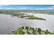Picturesque aerial view of a waterfront home surrounded by lush greenery and scenic lake views at 15779 Tangerine Dream Ct, Winter Garden, FL 34787