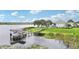 Gorgeous waterfront property featuring a private dock and meticulously maintained grounds at 15779 Tangerine Dream Ct, Winter Garden, FL 34787
