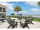 Outdoor fire pit surrounded by chairs providing a cozy spot to enjoy waterfront views and starlit evenings at 15779 Tangerine Dream Ct, Winter Garden, FL 34787