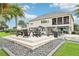 A spacious backyard offers an outdoor seating area, water feature, and stunning views at 15779 Tangerine Dream Ct, Winter Garden, FL 34787
