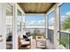 Cozy balcony featuring seating with a view of the water at 15779 Tangerine Dream Ct, Winter Garden, FL 34787