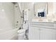 Charming bathroom with a shower/tub combo, white vanity, and elegant fixtures at 15779 Tangerine Dream Ct, Winter Garden, FL 34787