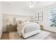 Serene bedroom with neutral tones, a large bed, and stylish decor at 15779 Tangerine Dream Ct, Winter Garden, FL 34787