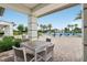 Relaxing poolside view with comfortable seating and lush landscaping, creating a serene community atmosphere at 15779 Tangerine Dream Ct, Winter Garden, FL 34787