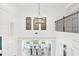 Grand dining room with high ceilings, statement chandelier, and elegant furnishings for sophisticated gatherings at 15779 Tangerine Dream Ct, Winter Garden, FL 34787