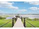 Scenic view of the private dock on the water, offering a tranquil escape with beautiful sky at 15779 Tangerine Dream Ct, Winter Garden, FL 34787
