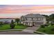 Stunning two-story waterfront home with meticulous landscaping and a paver driveway at 15779 Tangerine Dream Ct, Winter Garden, FL 34787