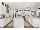 Open concept kitchen with sleek design, stainless appliances, dual islands, and ample storage at 15779 Tangerine Dream Ct, Winter Garden, FL 34787