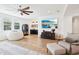 Cozy living room with a large beanbag chair, built-in shelving, and a large TV for entertainment at 15779 Tangerine Dream Ct, Winter Garden, FL 34787