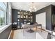 Inviting home office featuring a large desk, custom cabinets, and modern light fixtures at 15779 Tangerine Dream Ct, Winter Garden, FL 34787