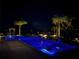 Inviting pool and spa with palm trees and fountains create a backyard oasis for relaxation and evening enjoyment at 15779 Tangerine Dream Ct, Winter Garden, FL 34787