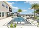 Luxurious pool with water features offers a serene oasis for relaxation and entertainment with waterfront views at 15779 Tangerine Dream Ct, Winter Garden, FL 34787