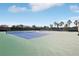 Well-maintained tennis courts with vibrant blue and green surfaces available for residents at 15779 Tangerine Dream Ct, Winter Garden, FL 34787