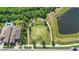 Aerial view of a park featuring a large open field, walking paths, and lush landscaping at 16013 Tollington Aly, Winter Garden, FL 34787