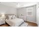 Cozy bedroom boasts wood floors, a ceiling fan, and a neutral color palette at 16013 Tollington Aly, Winter Garden, FL 34787