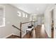 Upstairs hallway with a bench, natural light, and hardwood floors at 16013 Tollington Aly, Winter Garden, FL 34787