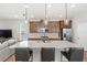 Beautiful kitchen with a large island, stainless steel appliances, and stylish pendant lighting at 16013 Tollington Aly, Winter Garden, FL 34787