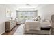 Bright main bedroom featuring soft neutral decor and lots of natural light from many windows at 16013 Tollington Aly, Winter Garden, FL 34787