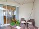 Inviting patio with outdoor seating, string lights, and sliding glass doors at 16013 Tollington Aly, Winter Garden, FL 34787