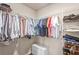 Walk-in closet with ample clothing storage, wire shelving, and hardwood flooring at 16013 Tollington Aly, Winter Garden, FL 34787