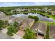 High aerial view with homes featuring backyard, and a lakefront with a scenic neighborhood at 1613 Water Elm Ct, Orlando, FL 32825